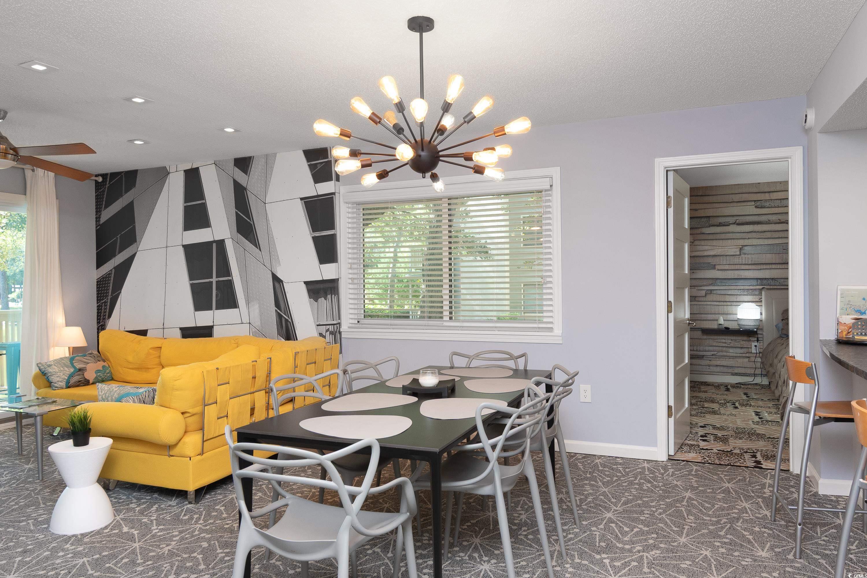 211 Baslow Court, Unit 2C Myrtle Beach, SC 29572 - Photo 8 of 33 Dining area featuring a textured ceiling and a chandelier