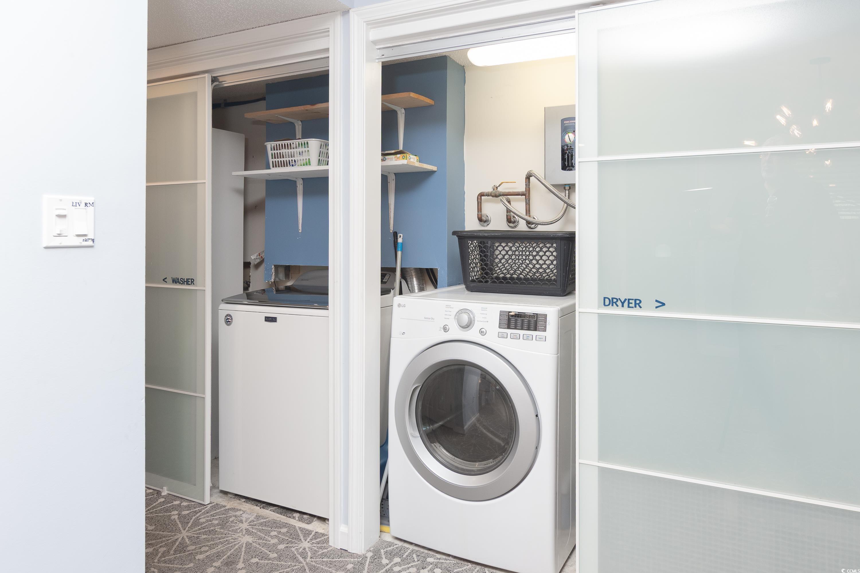 211 Baslow Court, Unit 2C Myrtle Beach, SC 29572 - Photo 9 of 33 Laundry room featuring washer and clothes dryer and electric panel