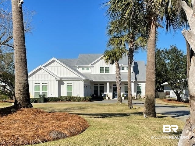 32937 River Road Orange Beach, AL 36561 - Photo 1 of 42 View of front facade featuring a front yard