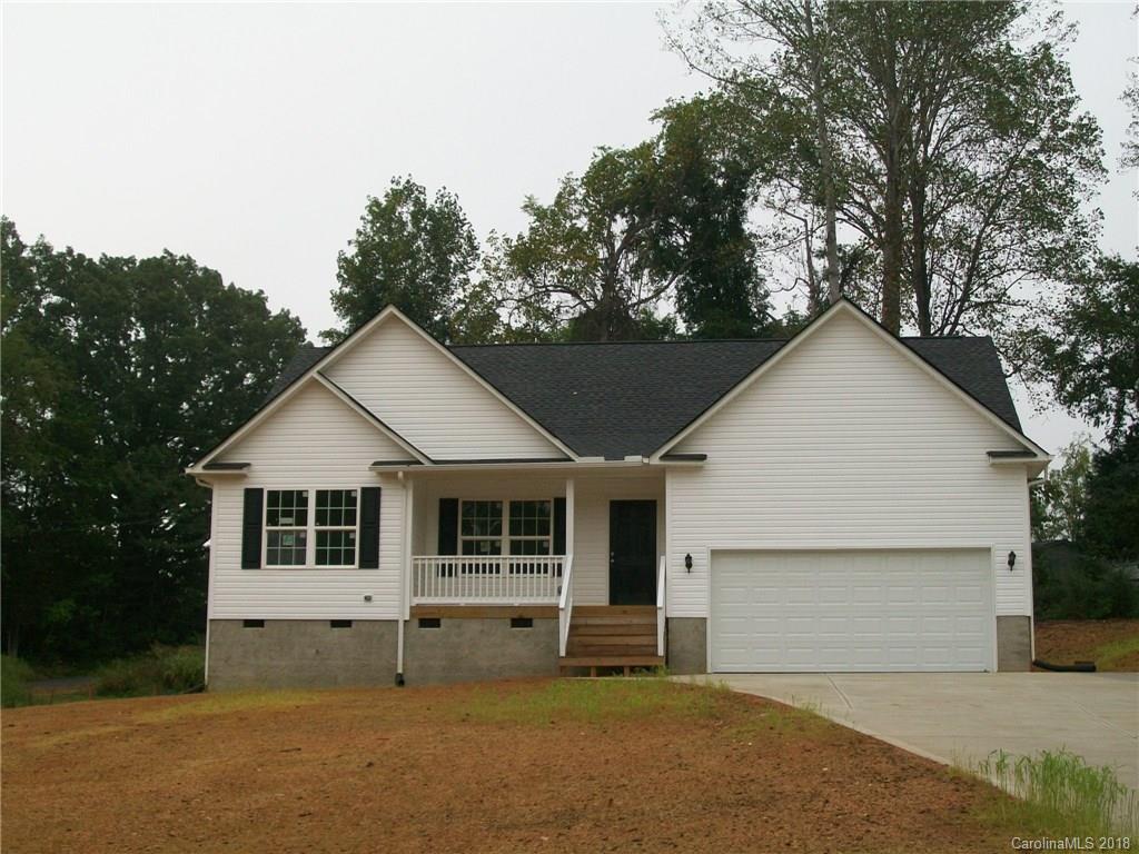 563 Kelly Road, Unit 2 York, SC 29745 - Photo 2 of 19 a front view of a house with a garden and yard