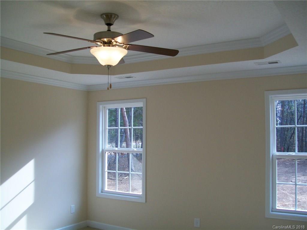 563 Kelly Road, Unit 2 York, SC 29745 - Photo 12 of 19 a a chandelier fan and windows