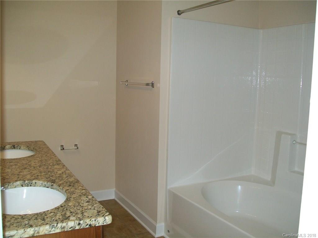 563 Kelly Road, Unit 2 York, SC 29745 - Photo 13 of 19 a bathroom with a granite countertop sink and a mirror
