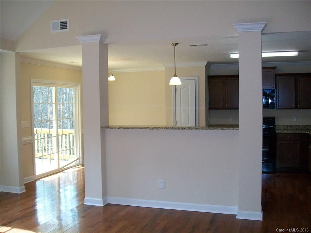 563 Kelly Road, Unit 2 York, SC 29745 - Photo 9 of 19 a view of a kitchen with a refrigerator and wooden floor