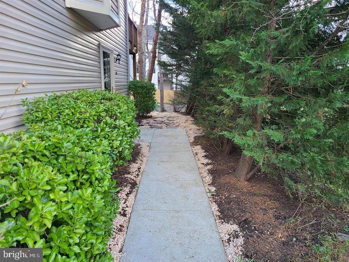 164 Tilden Way, Unit 164 Edgewater, MD 21037 - Photo 24 of 24 a view of a pathway with a house