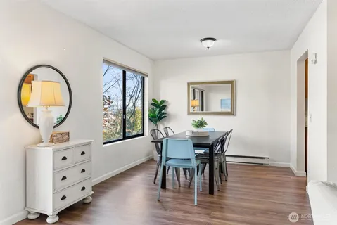 a view of a dining room with furniture and window