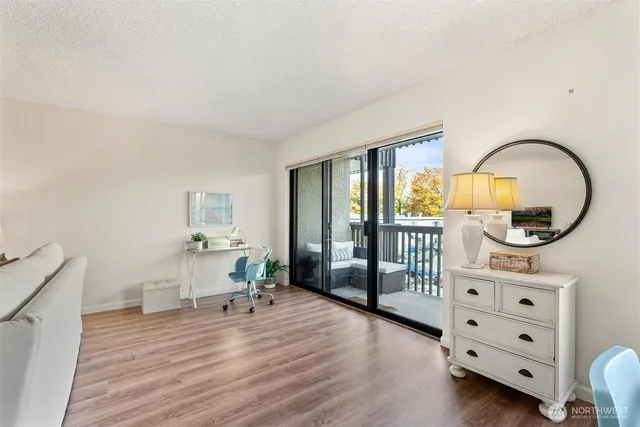 a bedroom with furniture and a window