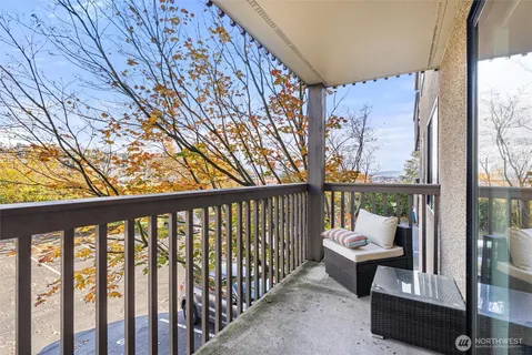 a view of a two chairs in the balcony
