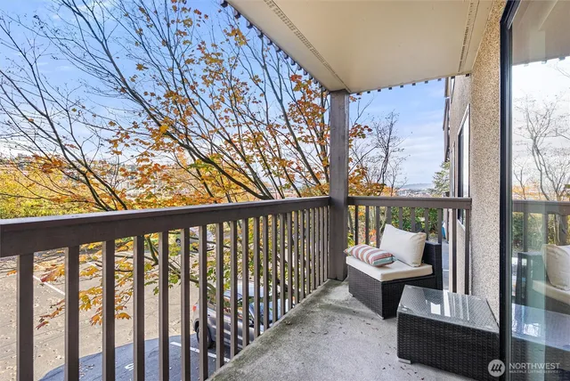 a view of a two chairs in the balcony