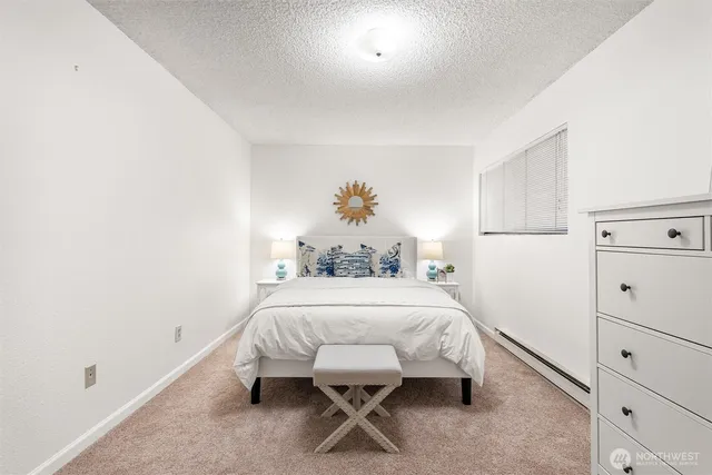 a bedroom with a bed and a table