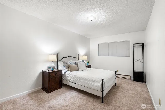 a bedroom with double bed and a night stand