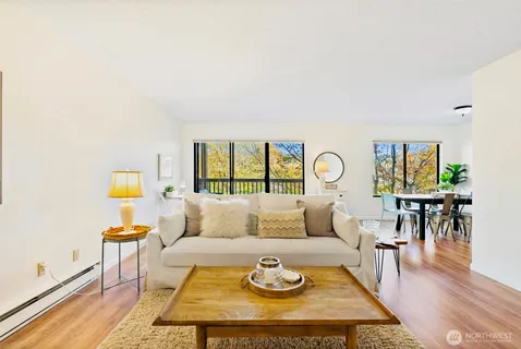 a living room with furniture and a table