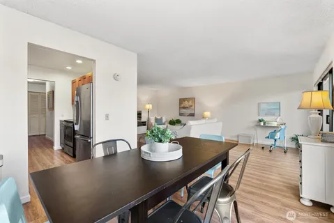 a view of a dining room with furniture and wooden floor