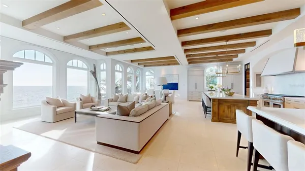 a bedroom with a large bed and a large window