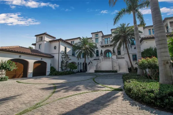a kitchen with stainless steel appliances kitchen island granite countertop a sink and cabinets