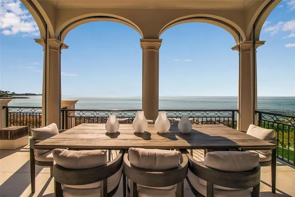 a view of a workspace with furniture and a chandelier