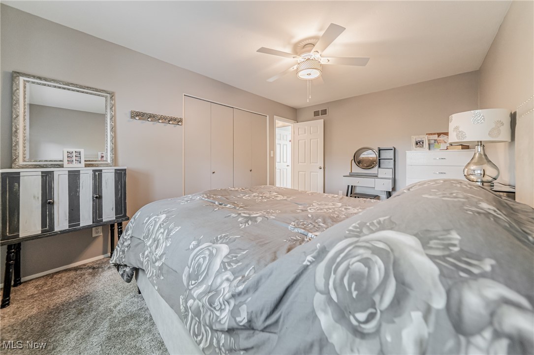 595 Moorfield Road Fairlawn, OH 44313 - Photo 20 of 50 Carpeted bedroom with a closet and ceiling fan