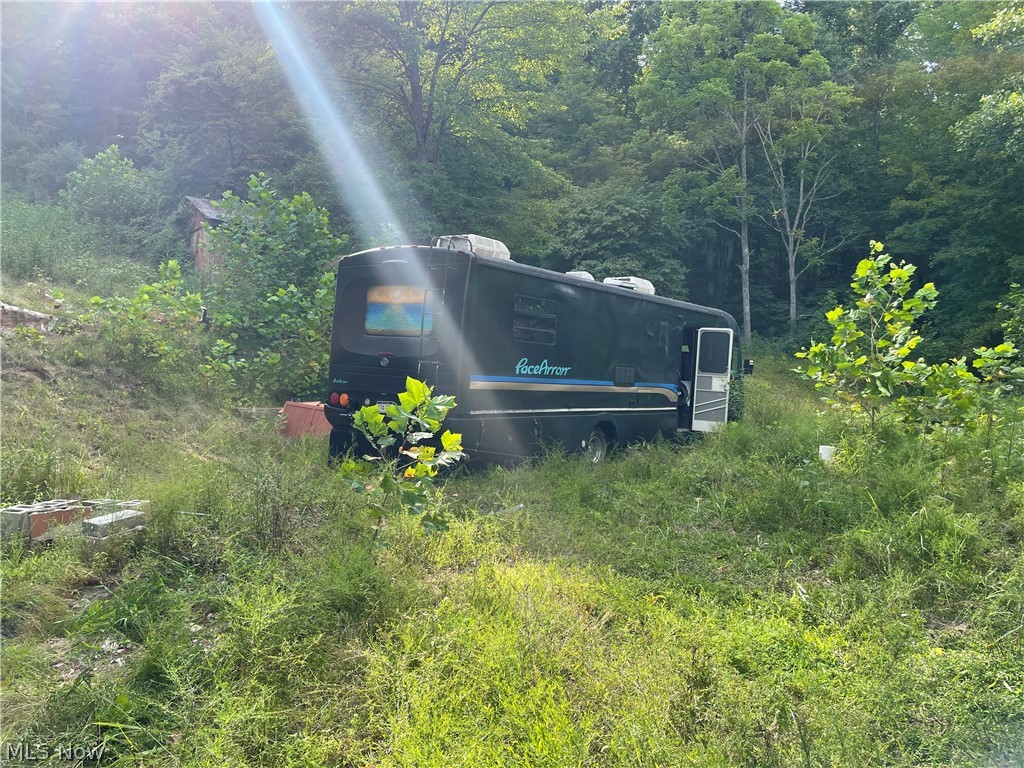 291 A Frame Road New Milton, WV 26411 - Photo 6 of 21 RV on concrete slab past the garage