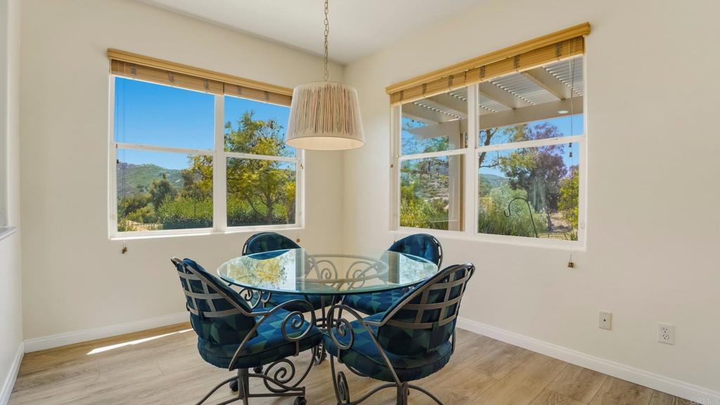2527 Southern Oak Road Ramona, CA 92065 - Photo 23 of 56 a dining room with furniture window and wooden floor