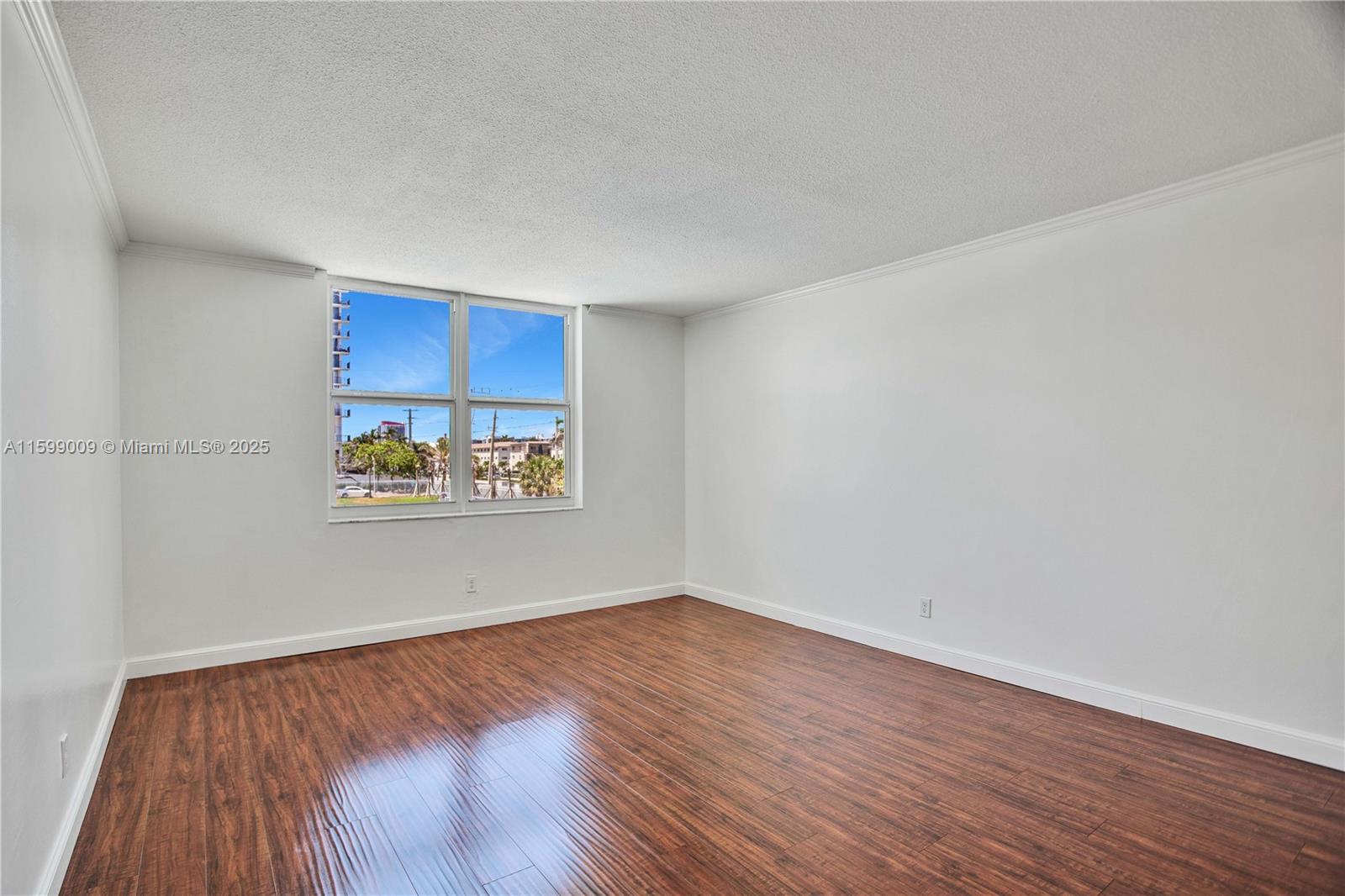 1901 South Ocean Drive, Unit 207 Hollywood, FL 33019 - Photo 18 of 47 a view of an empty room and wooden floor