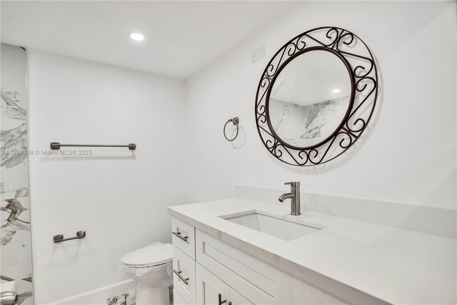 1901 South Ocean Drive, Unit 207 Hollywood, FL 33019 - Photo 20 of 47 a bathroom with a sink and a mirror