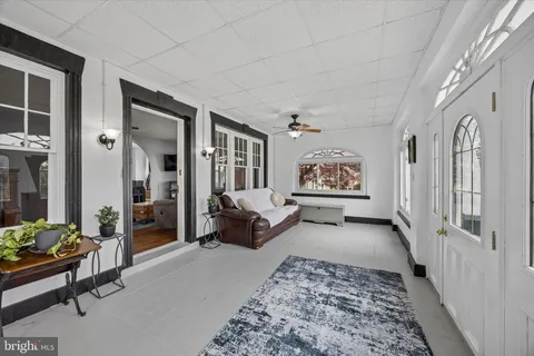 a living room with furniture and a rug