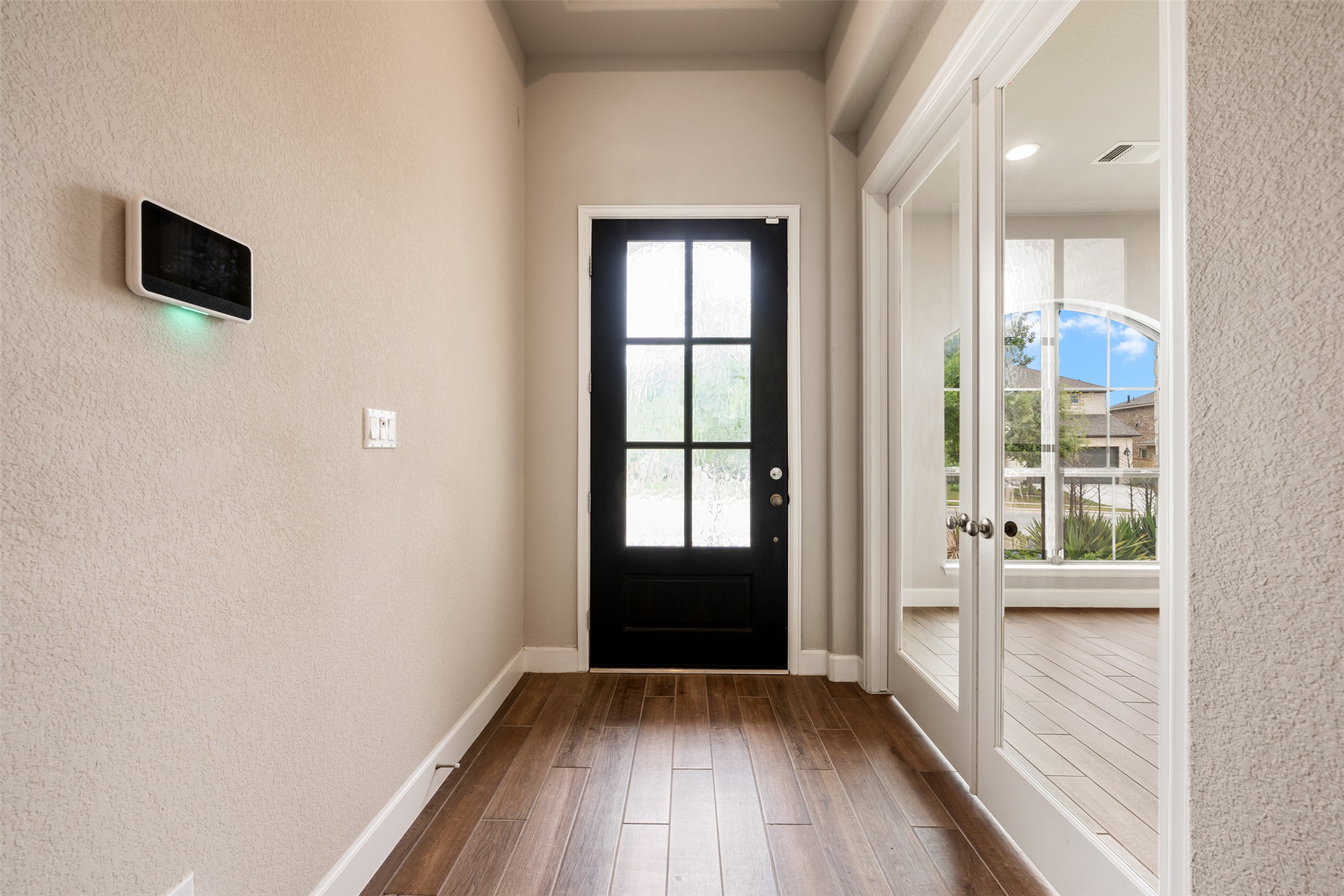 104 Anejo Bluff Georgetown, TX 78628 - Photo 3 of 40 wooden floor in an empty room with a window