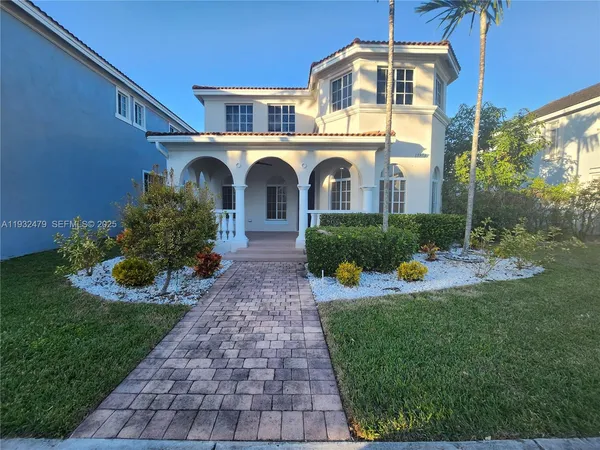 a front view of a house with a yard