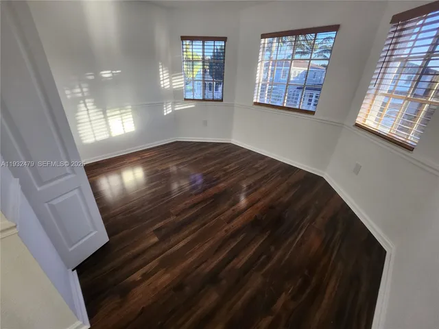 a view of an empty room and window