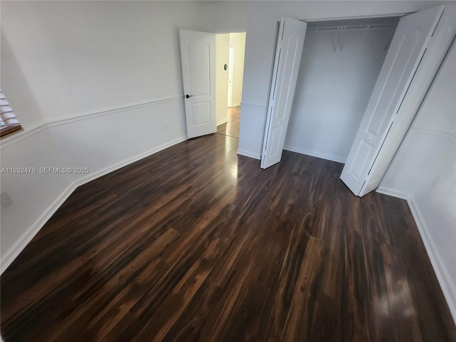 13973 Southwest 276th Way Homestead, FL 33032 - Photo 25 of 43 a view of wooden floor in an empty room