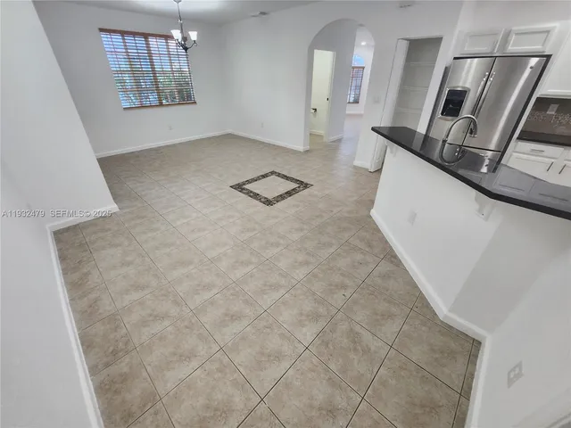 a view of room with wooden floor