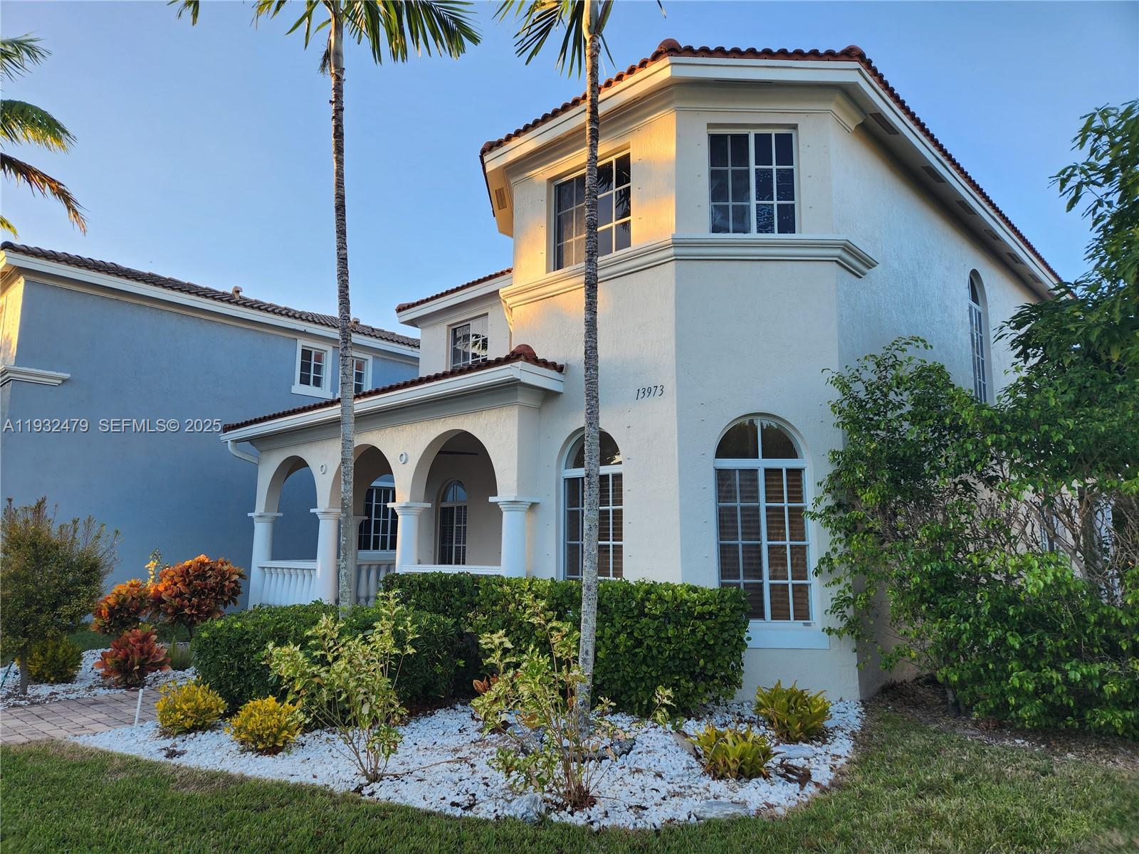 13973 Southwest 276th Way Homestead, FL 33032 - Photo 43 of 43 a front view of a house with a yard