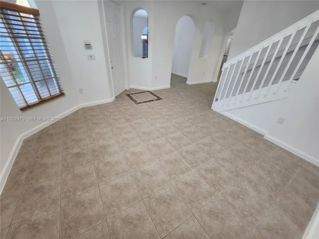 a view of a livingroom with stairs