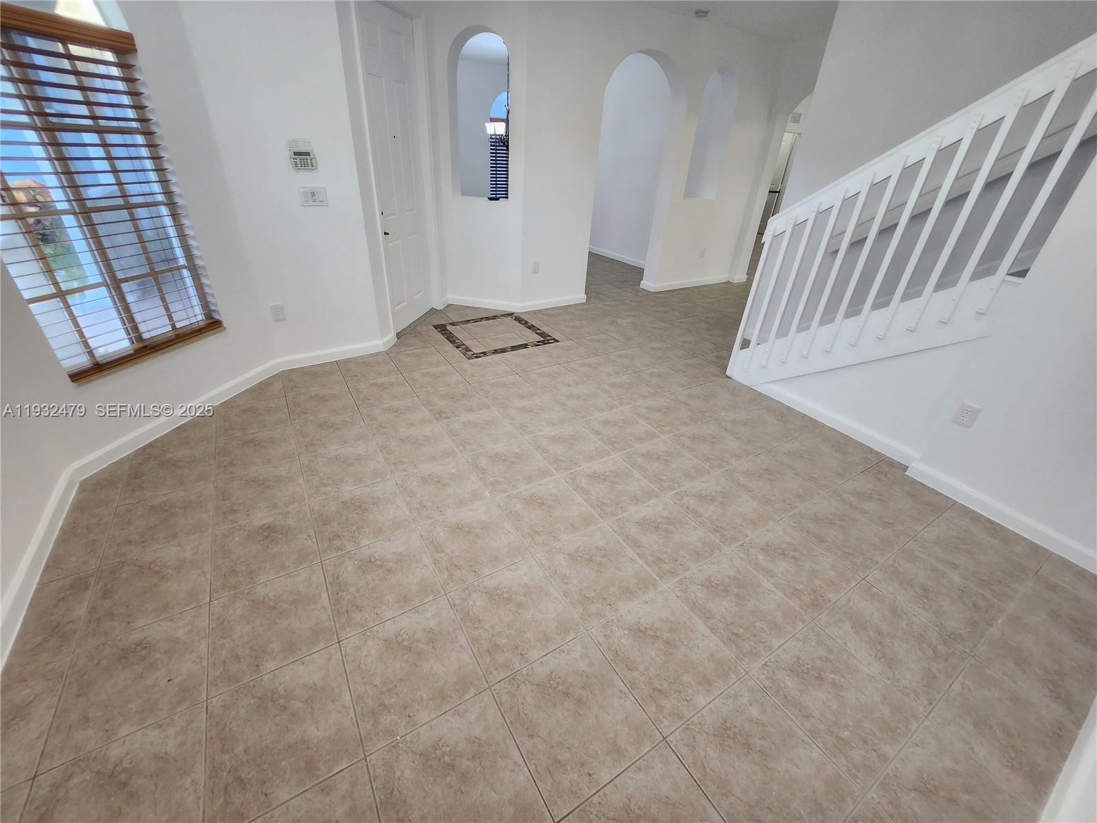 13973 Southwest 276th Way Homestead, FL 33032 - Photo 7 of 43 a view of a livingroom with stairs