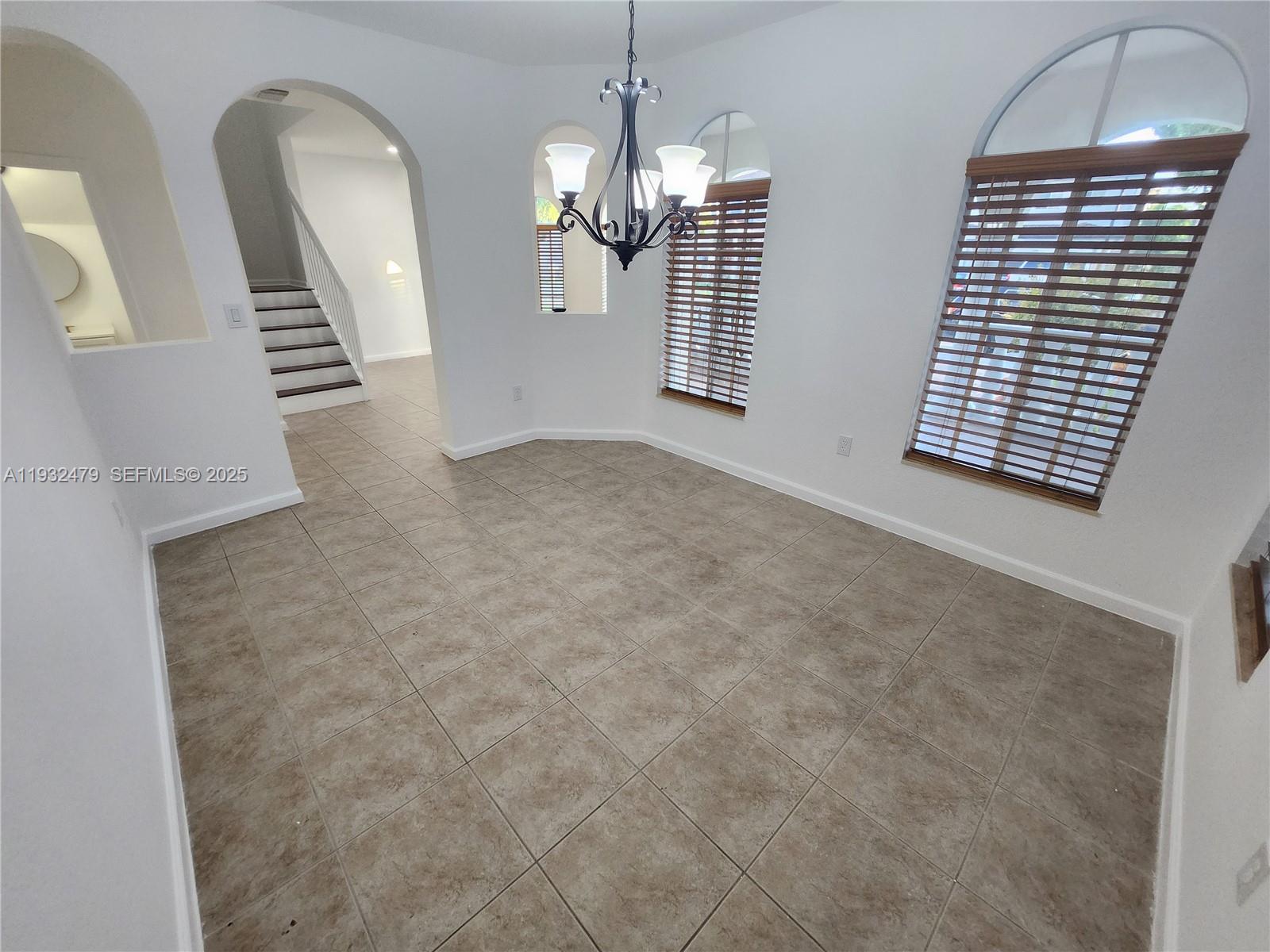 13973 Southwest 276th Way Homestead, FL 33032 - Photo 9 of 43 a view of an empty room with a window