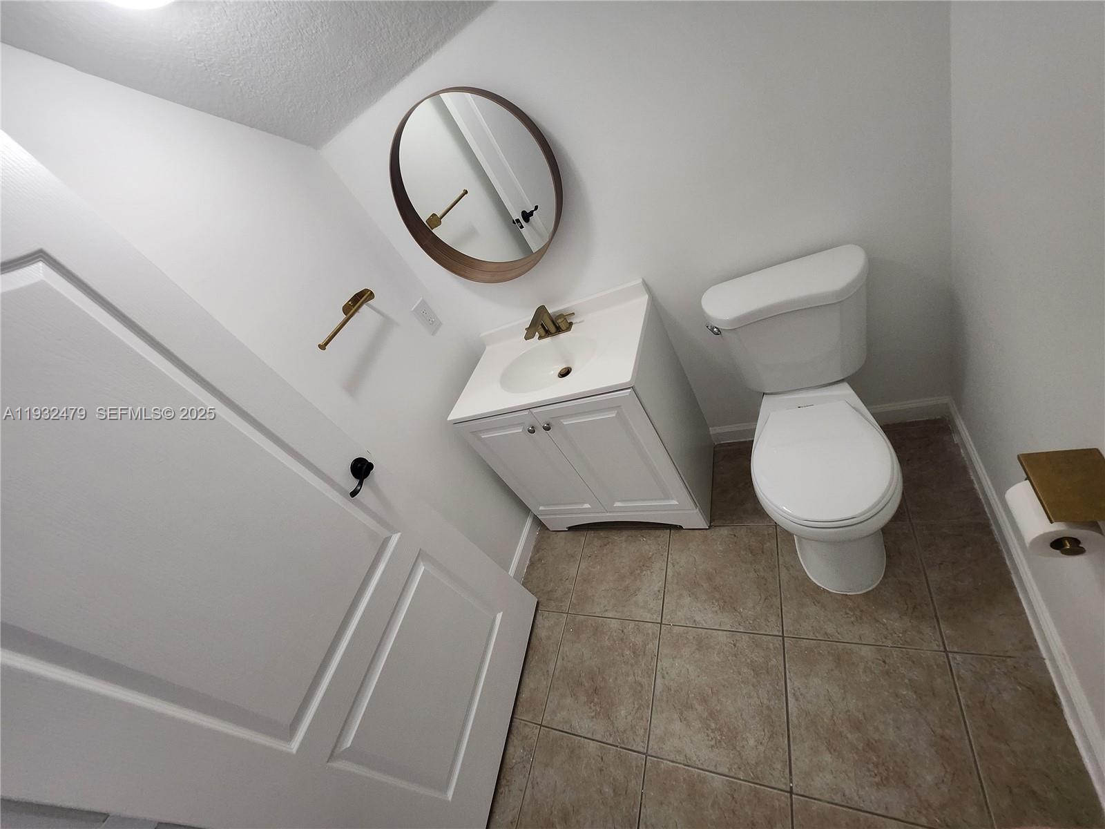 13973 Southwest 276th Way Homestead, FL 33032 - Photo 10 of 43 a white toilet sitting next to a white sink