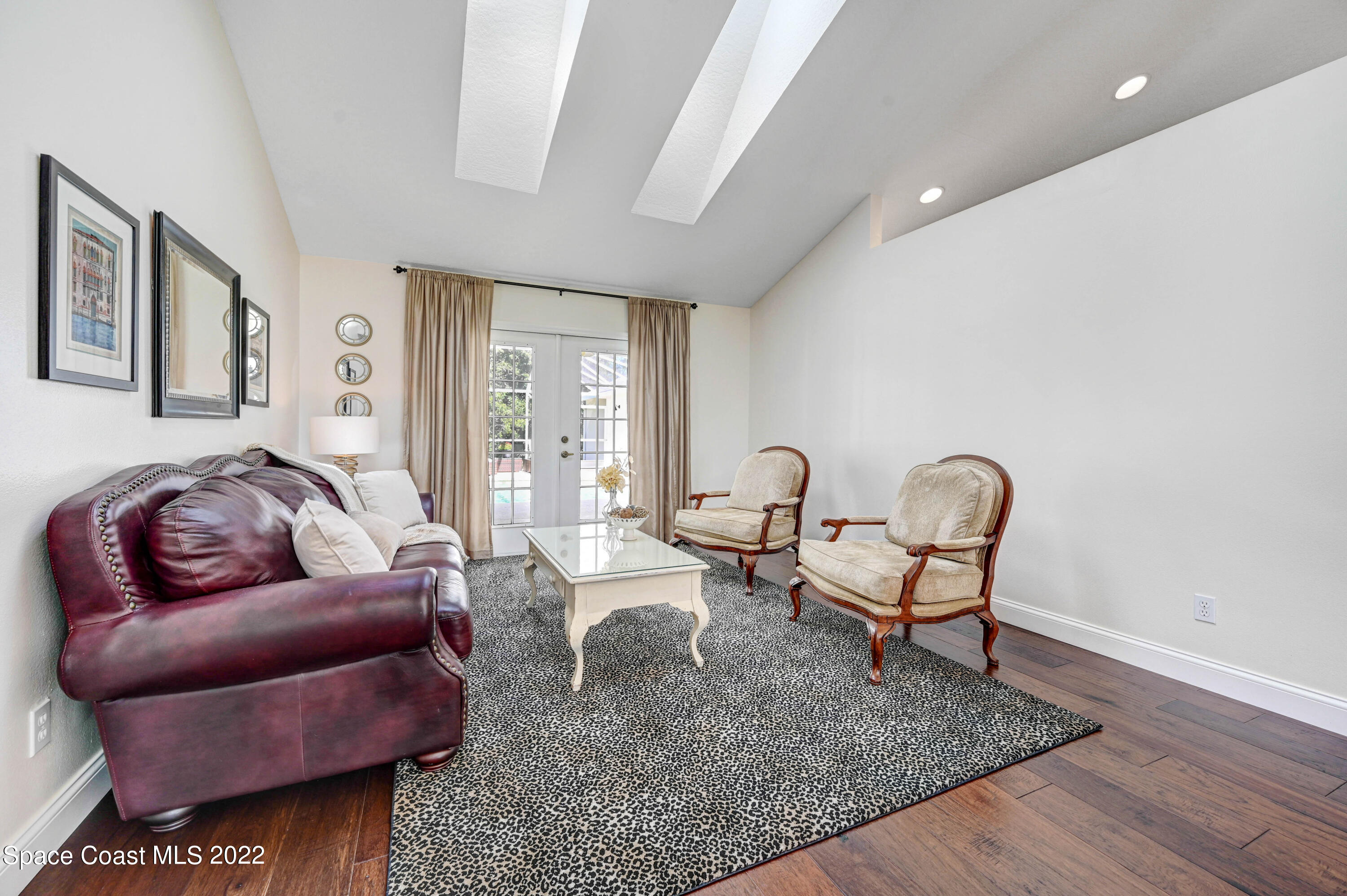 3700 Big Pine Road Melbourne, FL 32934 - Photo 11 of 64 a living room with furniture and a rug