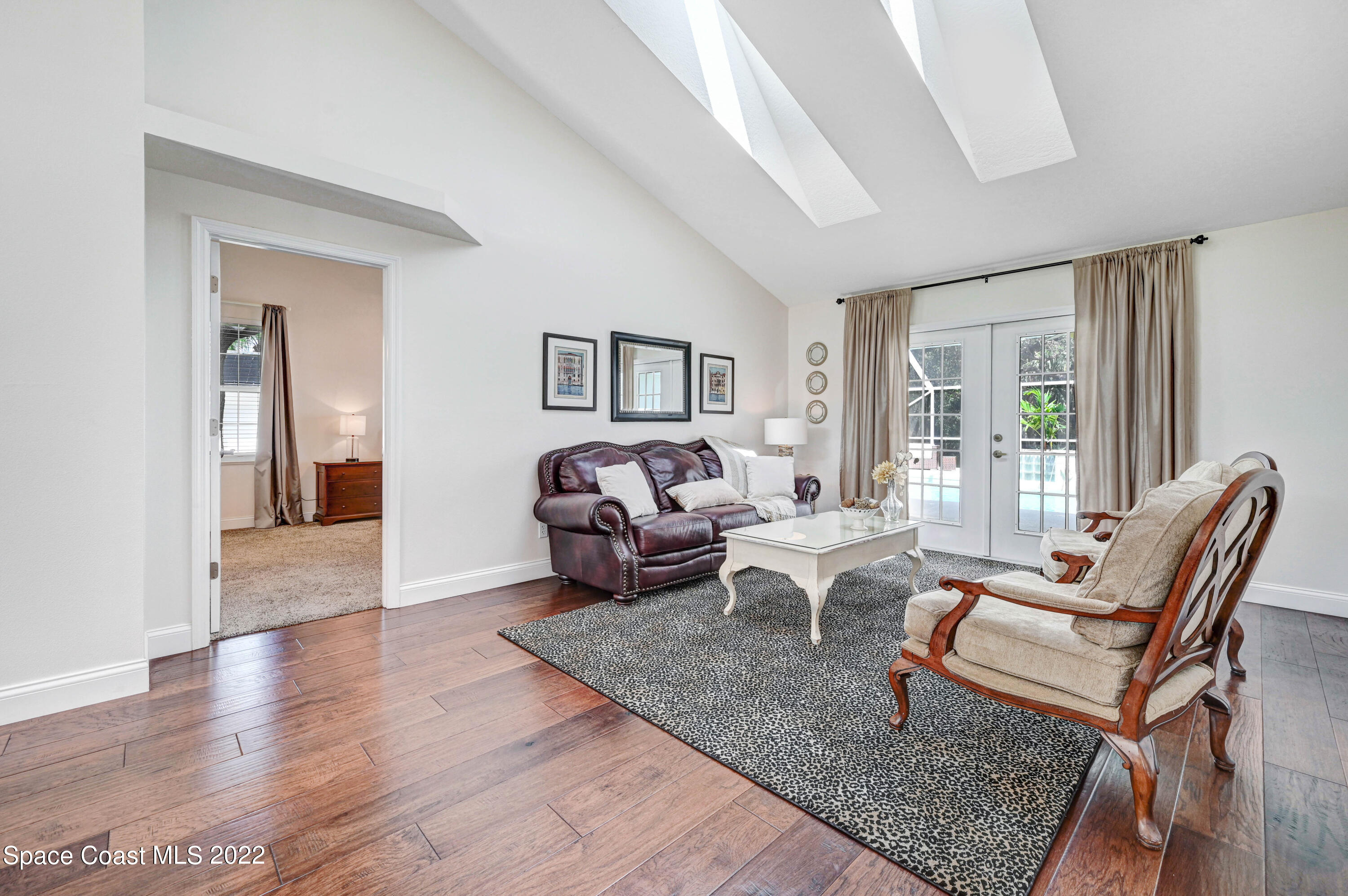3700 Big Pine Road Melbourne, FL 32934 - Photo 12 of 64 a living room with furniture and wooden floor