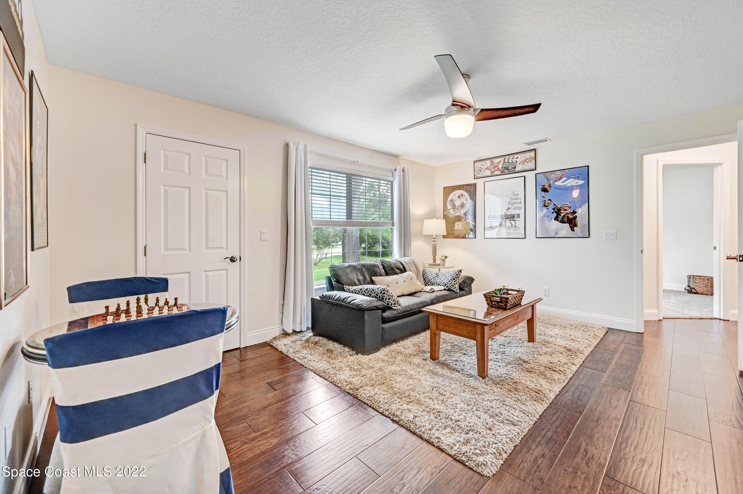 3700 Big Pine Road Melbourne, FL 32934 - Photo 35 of 64 a living room with furniture and a rug