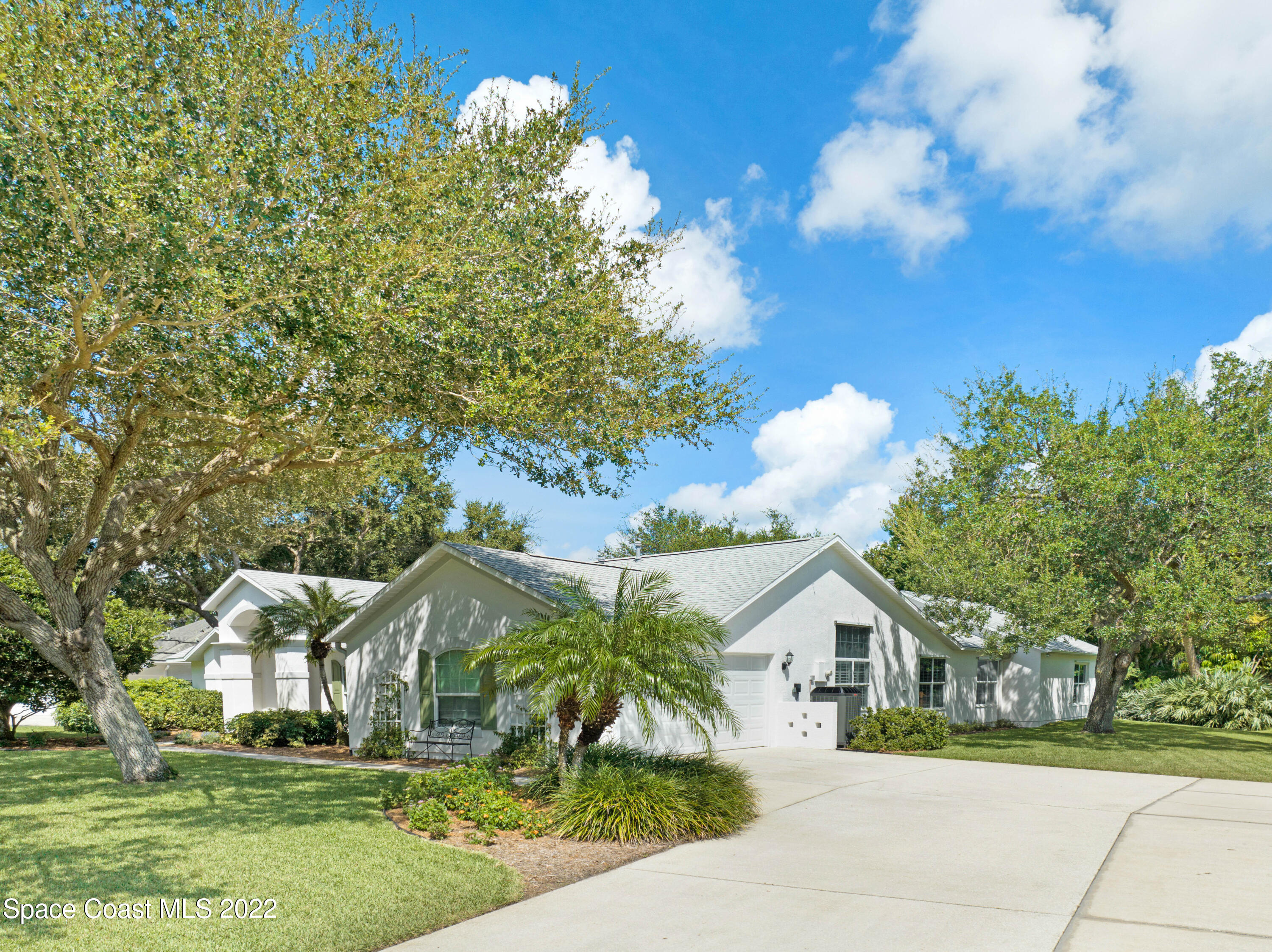 3700 Big Pine Road Melbourne, FL 32934 - Photo 4 of 64 a front view of a house with a yard