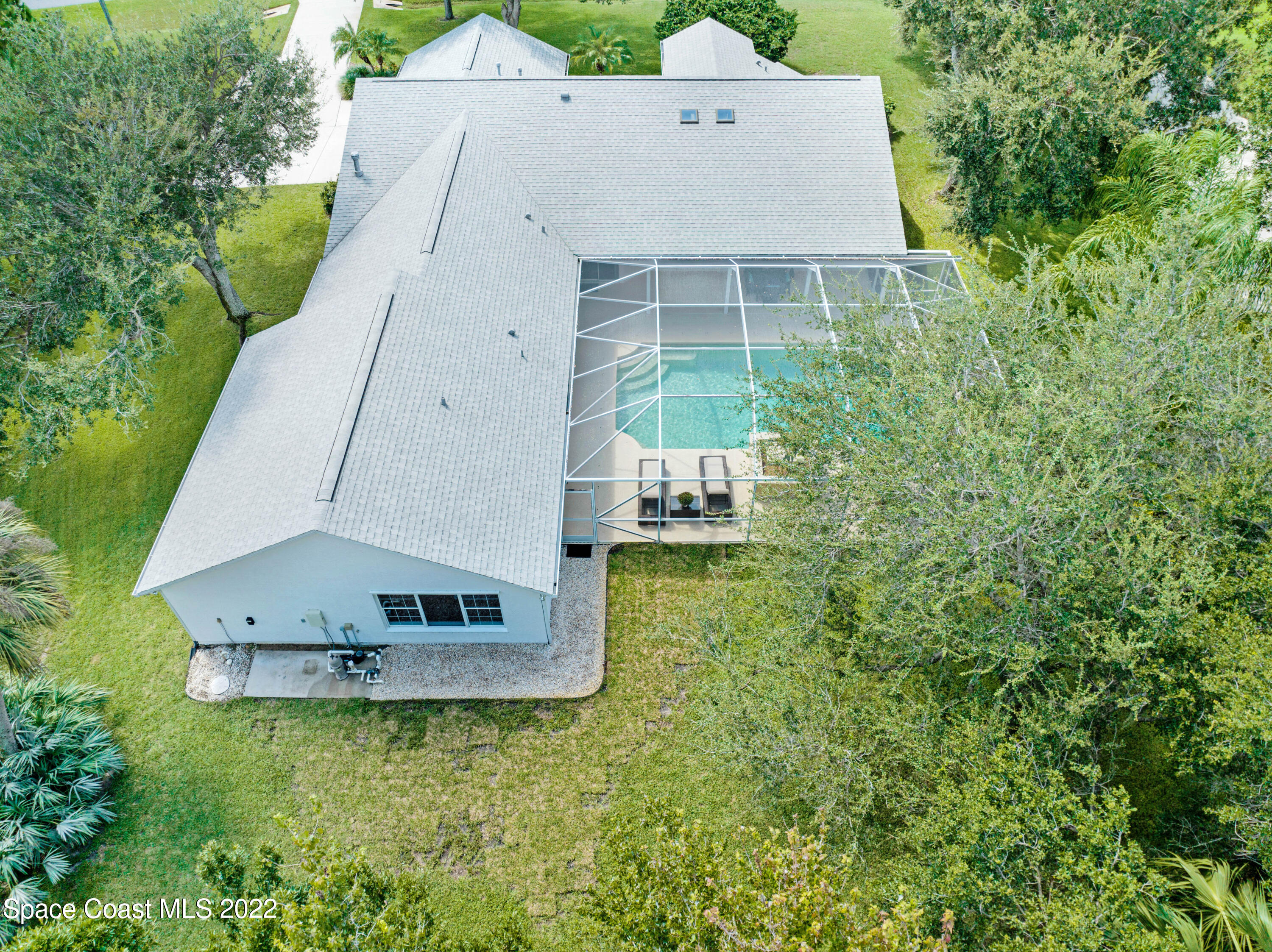 3700 Big Pine Road Melbourne, FL 32934 - Photo 63 of 64 a aerial view of a house with a yard and large tree