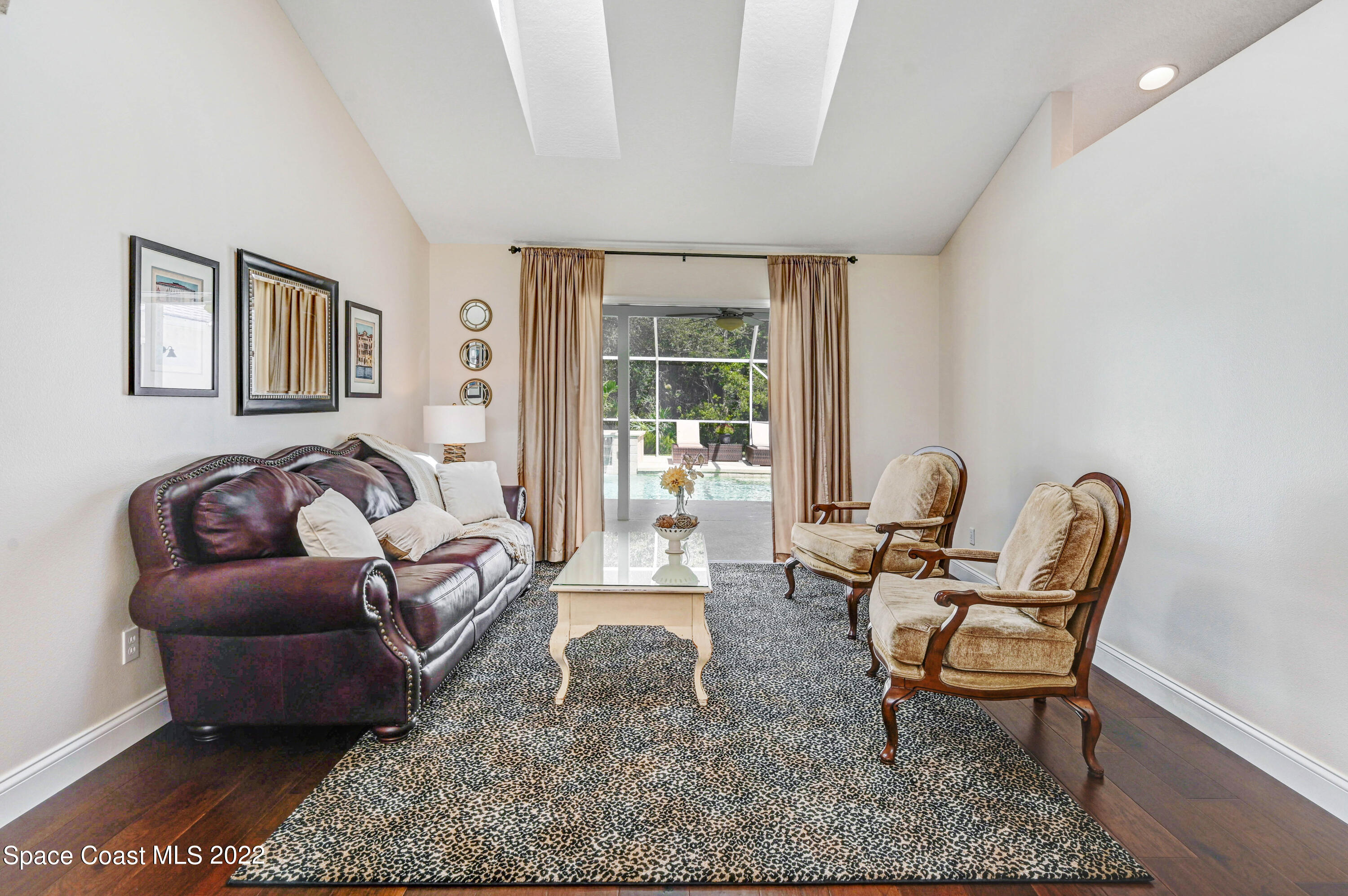 3700 Big Pine Road Melbourne, FL 32934 - Photo 10 of 64 a living room with furniture and a large window