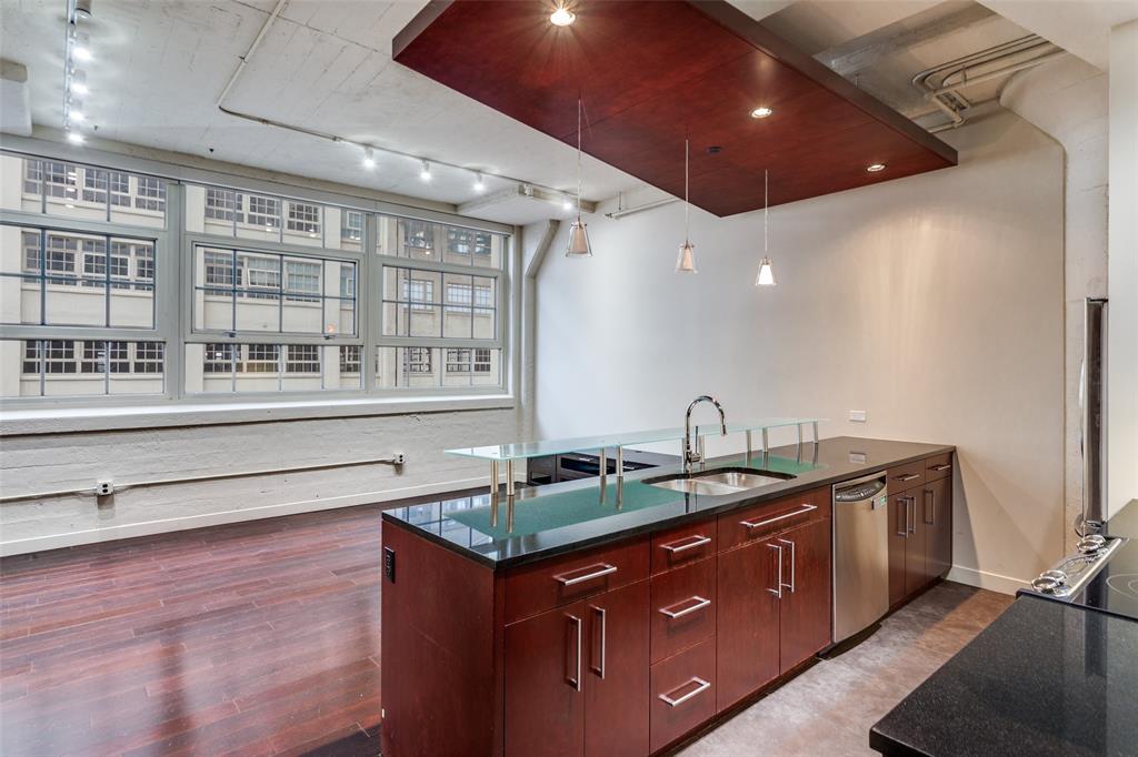 2600 West 7th Street, Unit 1311 Fort Worth, TX 76107 - Photo 1 of 25 a kitchen with stainless steel appliances granite countertop a sink and a counter space