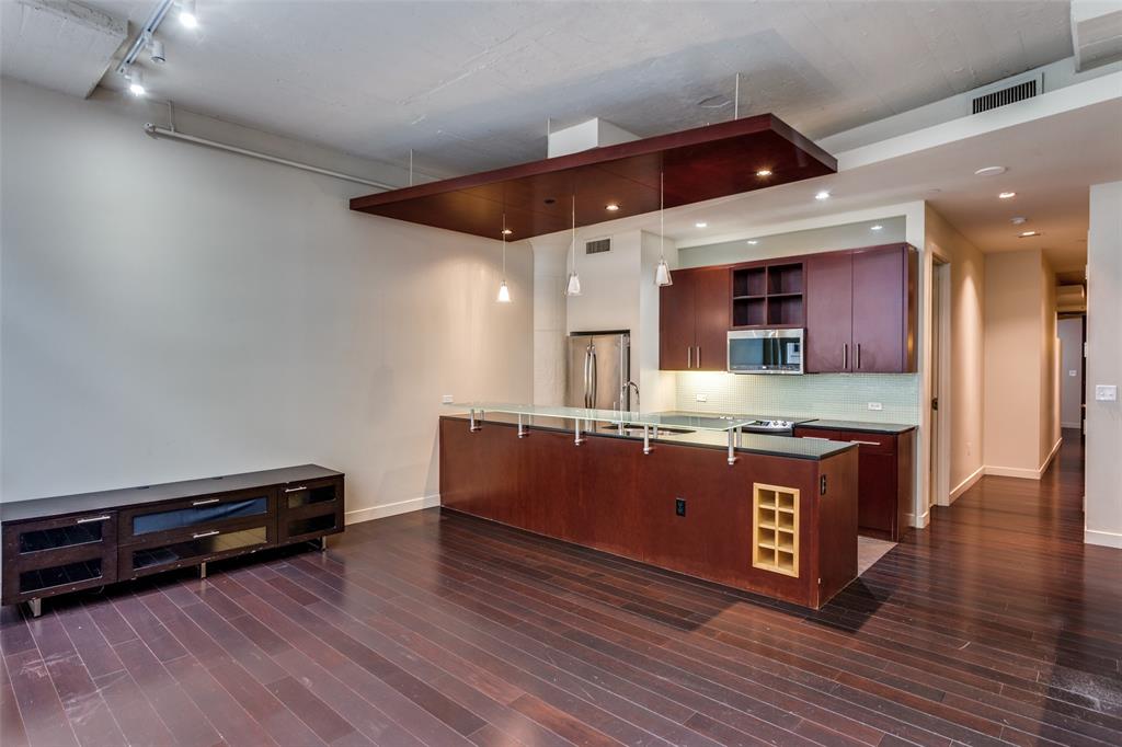 2600 West 7th Street, Unit 1311 Fort Worth, TX 76107 - Photo 11 of 25 a kitchen with stainless steel appliances granite countertop a stove and a sink