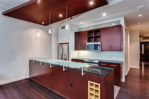 an open kitchen with a table and chairs
