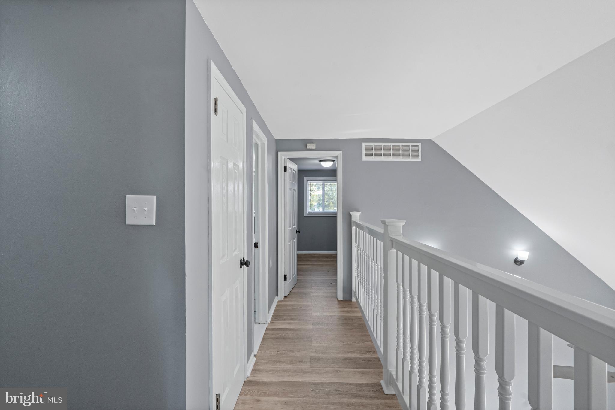 737 Watsontown Road Berlin, NJ 08009 - Photo 16 of 23 a view of a hallway with wooden floor and entryway