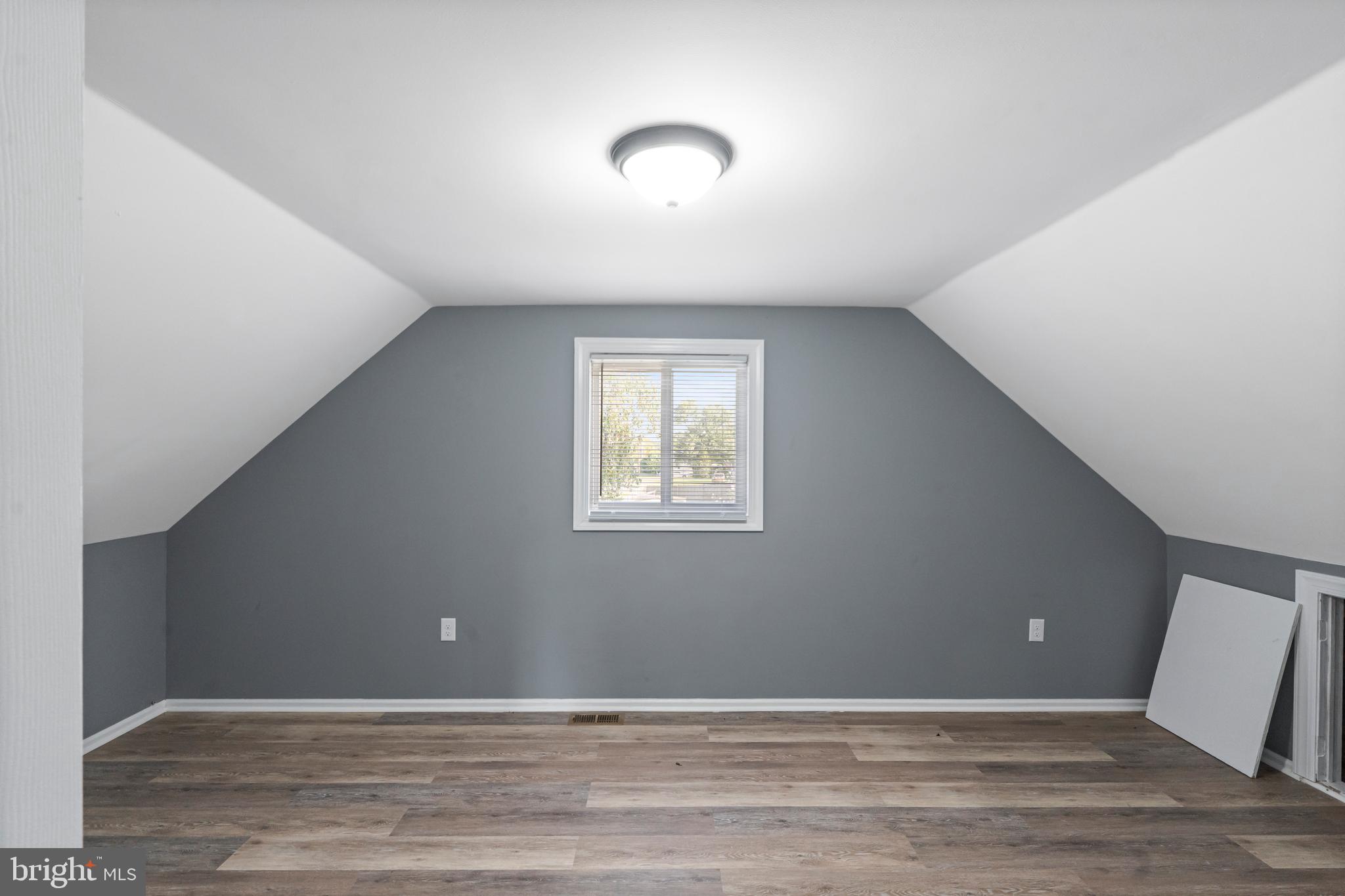 737 Watsontown Road Berlin, NJ 08009 - Photo 18 of 23 a view of an empty room with wooden floor and a window