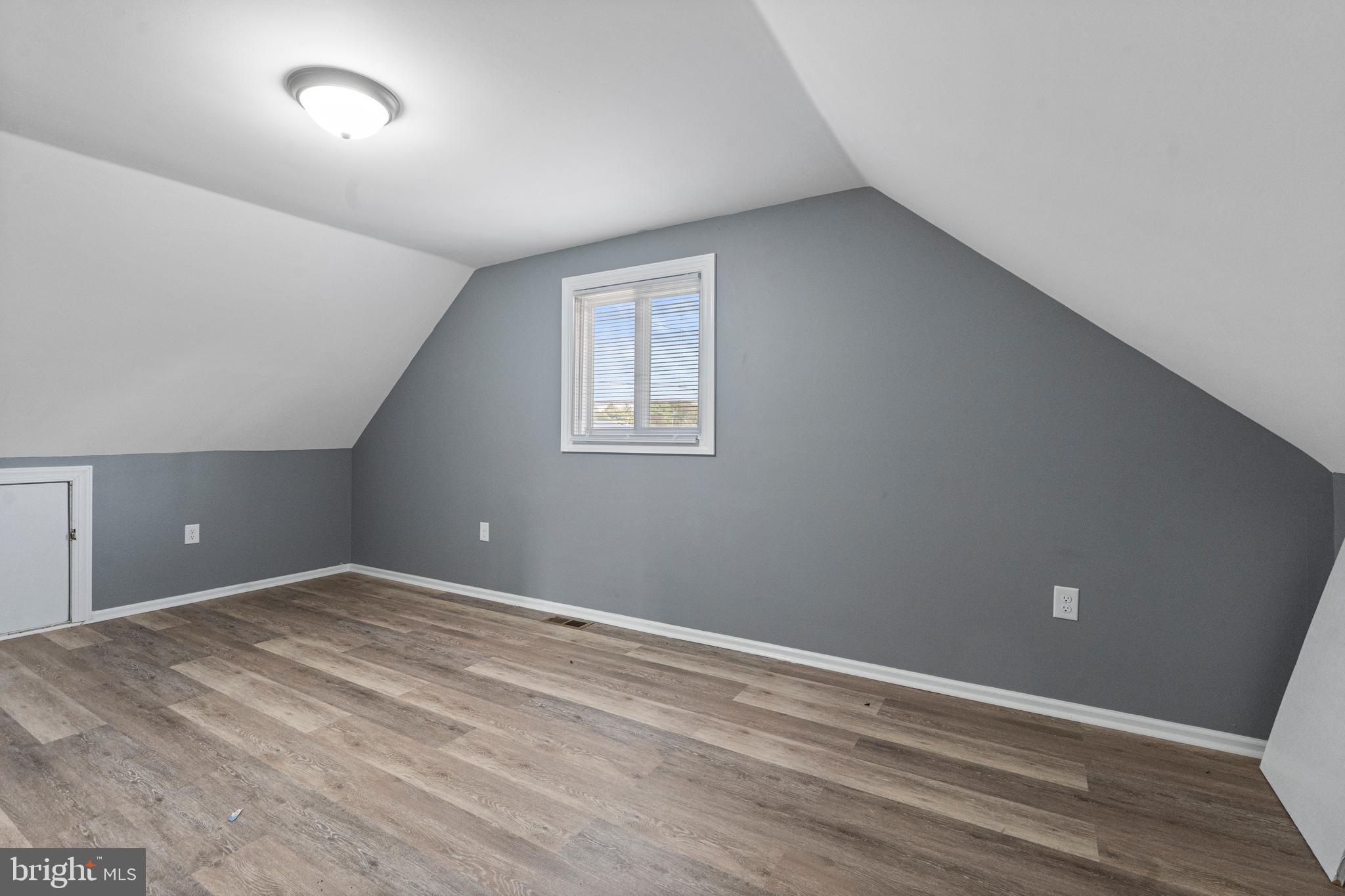 737 Watsontown Road Berlin, NJ 08009 - Photo 19 of 23 a view of an empty room with wooden floor and a window