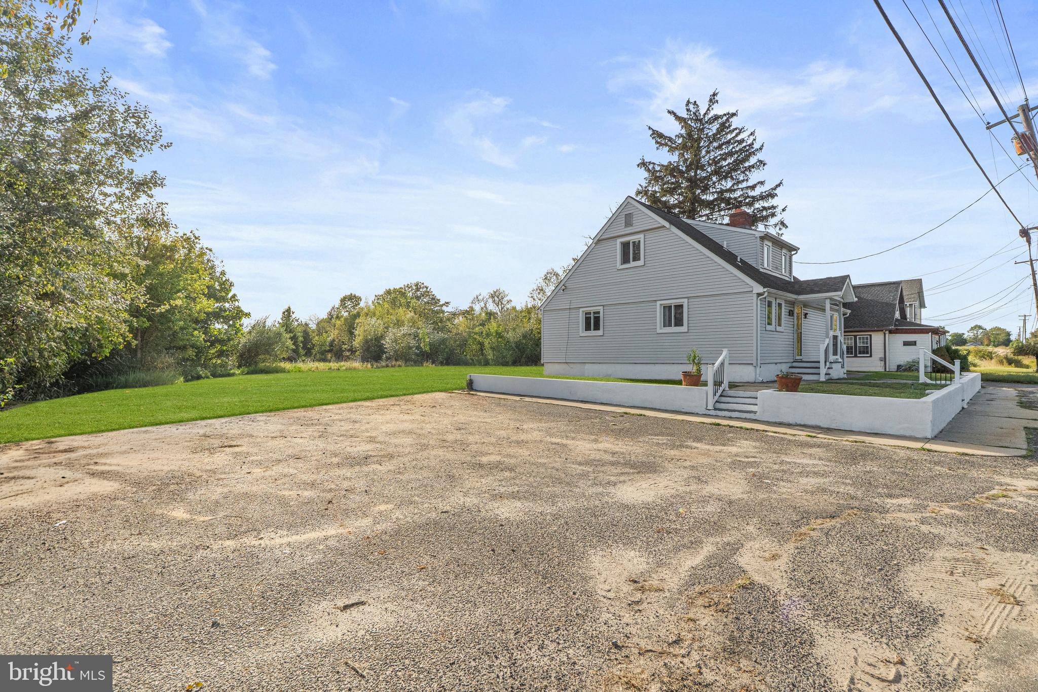737 Watsontown Road Berlin, NJ 08009 - Photo 2 of 23 a view of a house with a yard and garage