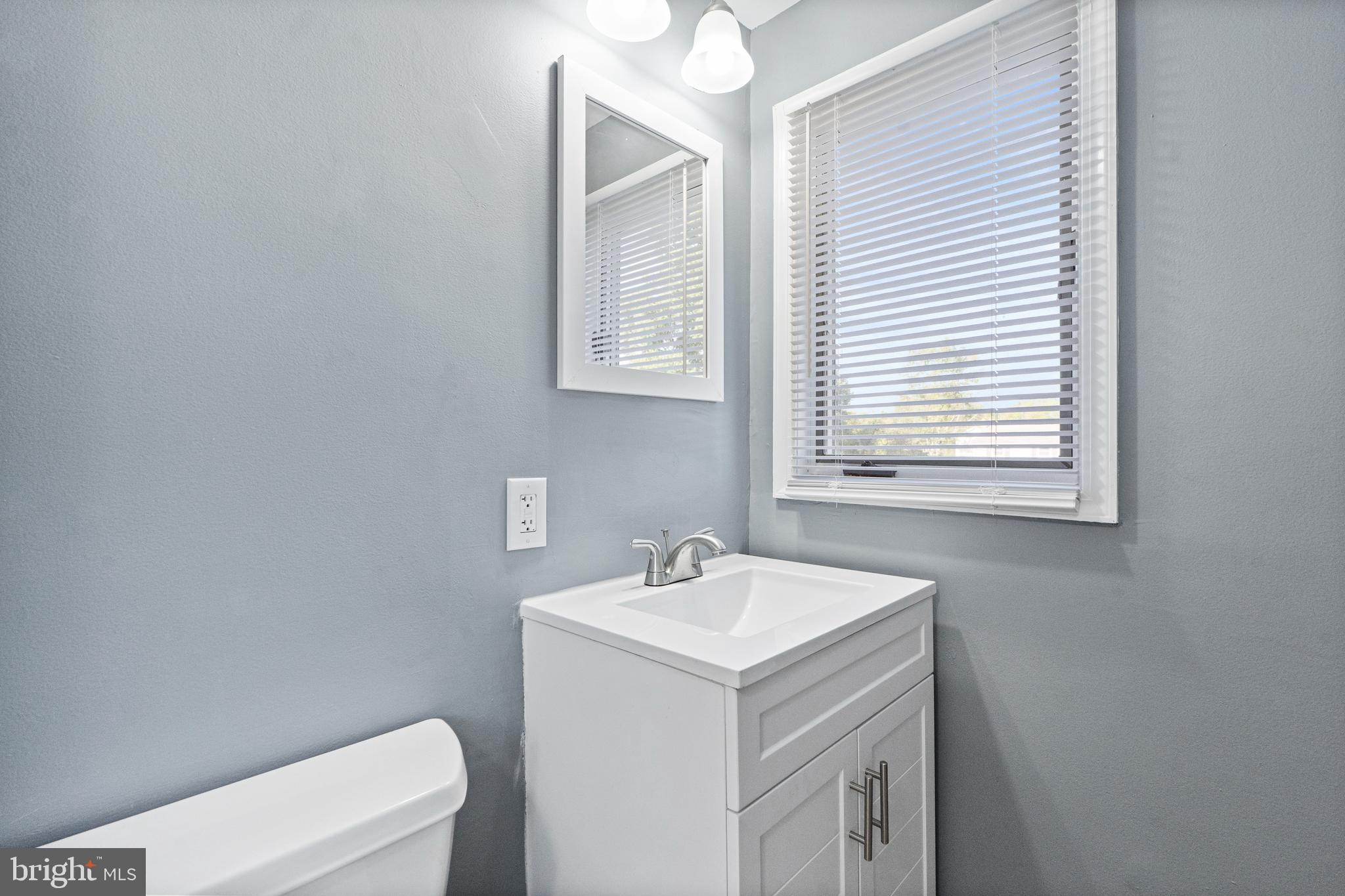 737 Watsontown Road Berlin, NJ 08009 - Photo 10 of 23 a bathroom with a sink a toilet and a window