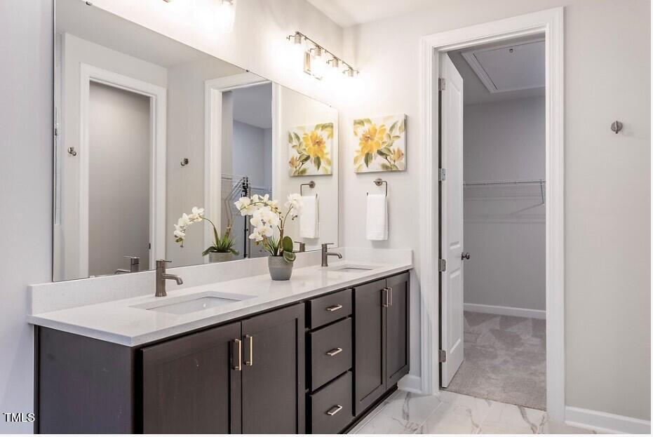 6103 Adecor Way Raleigh, NC 27617 - Photo 21 of 27 a bathroom with a sink and a mirror